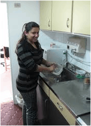 maid cleaning kitchen
